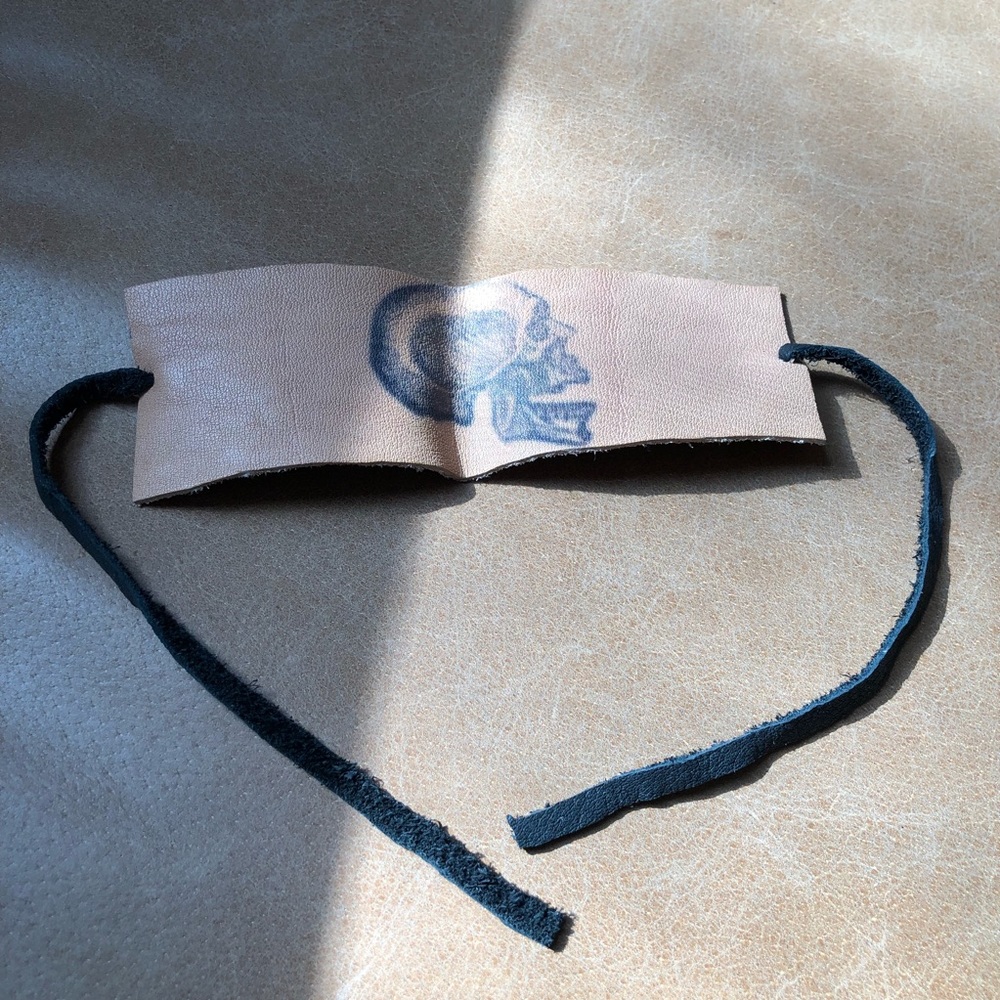 Hand cut stamped skull leather bracelet